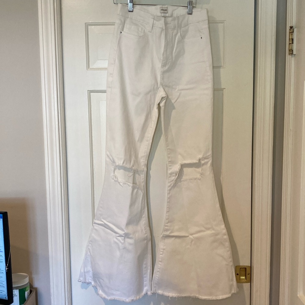 Sneak Peek Lynn High rise flared hem jeans with distressed knees. Huge flair. 28
